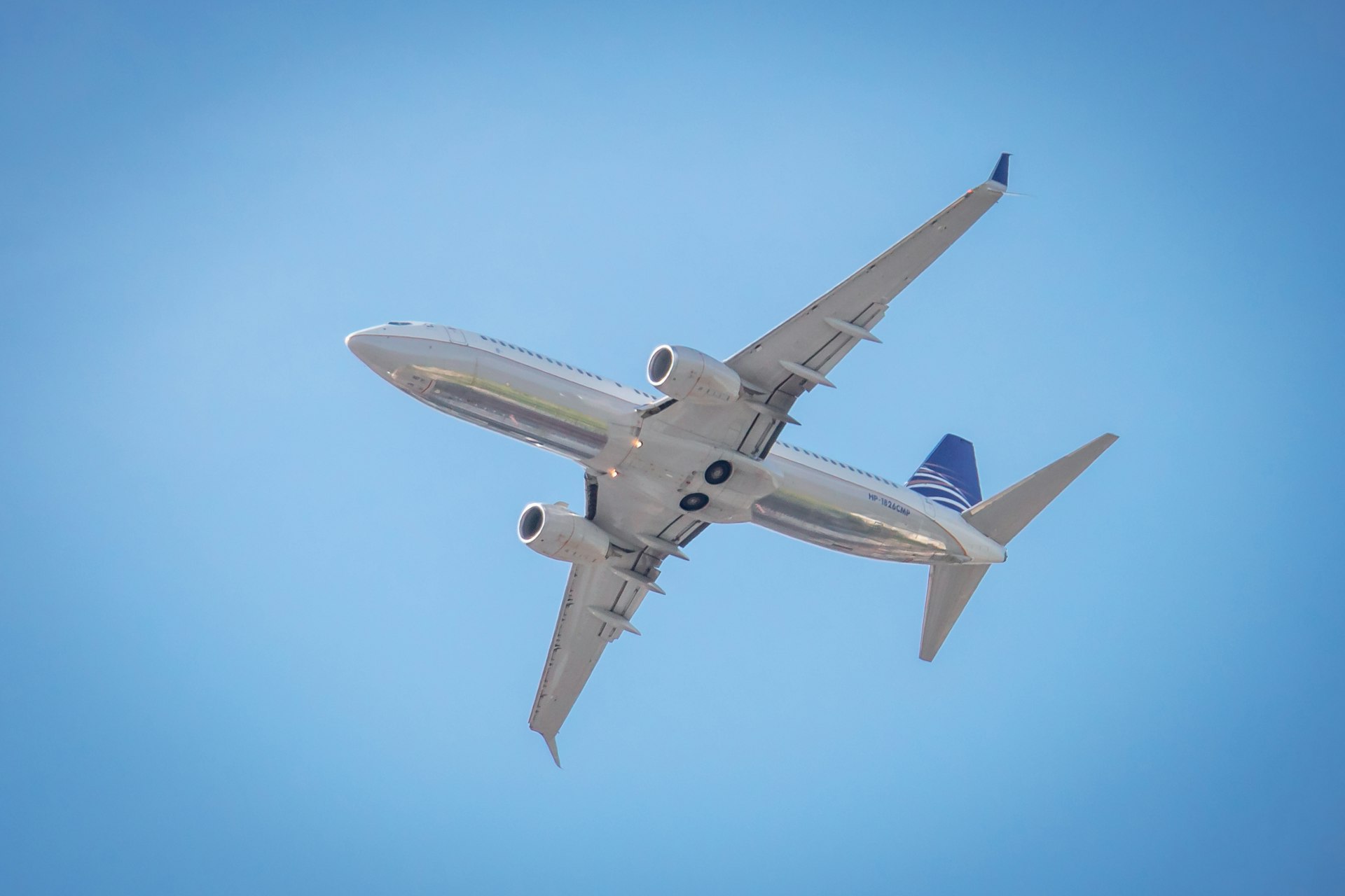 a large passenger jet flying through a blue sky